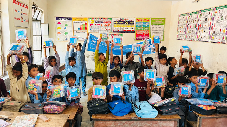 HTX Charity in Action: Delivering Warmth and Care to Children in Pakistan on Bitcoin Pizza Day