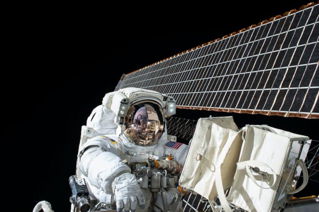 Astronaut doing repairs in space